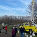 Custom Exterior Landscape setting up holiday lights in Rocky Hill