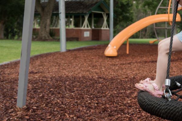 fresh mulch on a children's outdoor playscape