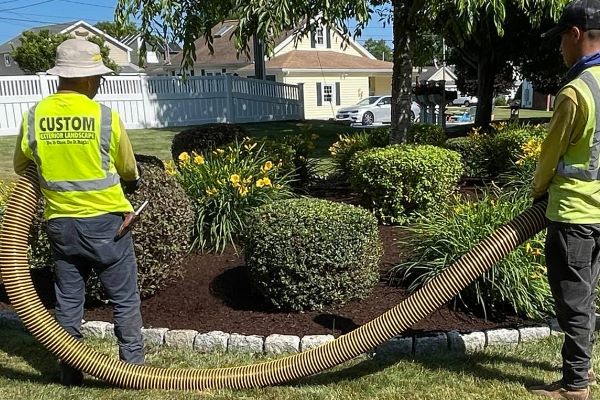 Mulch blowing into a West Hartford garden