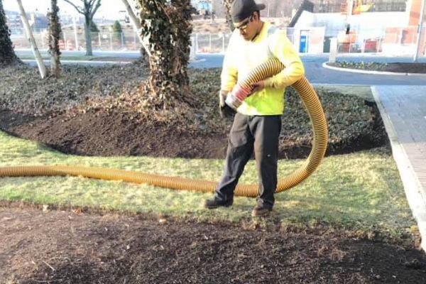 blowing in mulch on commercial property in Newington