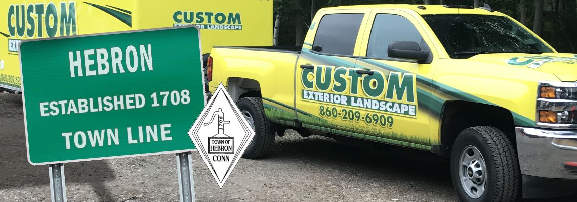 Custom Exterior Landscape Truck and Trailer with the welcome to Hebron sign and the Hebron CT seal