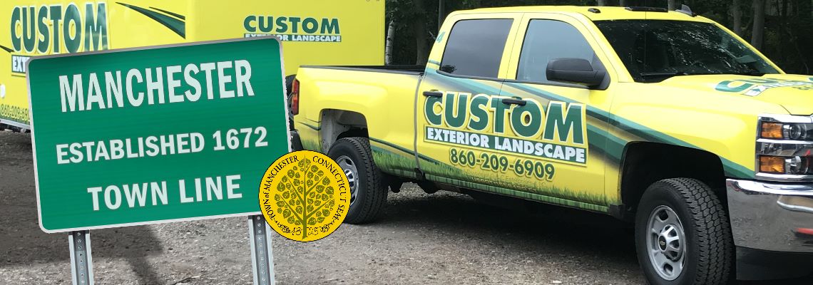 Custom Exterior Landscape Truck and Trailer with the welcome to Manchester sign and the Manchester CT seal