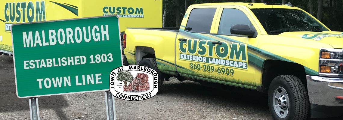 Custom Exterior Landscape Truck and Trailer with the welcome to Marlborough sign and the Marlborough CT seal