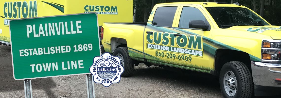 Custom Exterior Landscape Truck and Trailer with the welcome to Plainville sign and the Plainville CT seal